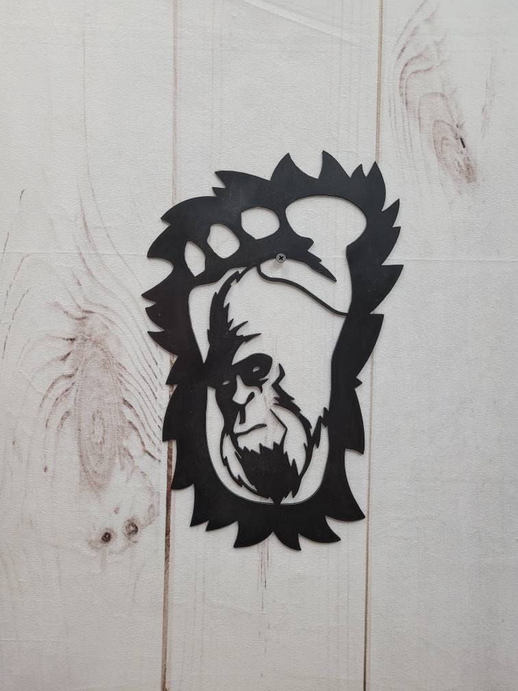 Bigfoot Footprint Metal Sign Bigfoot Aluminum Sign — shown on a rustic wall