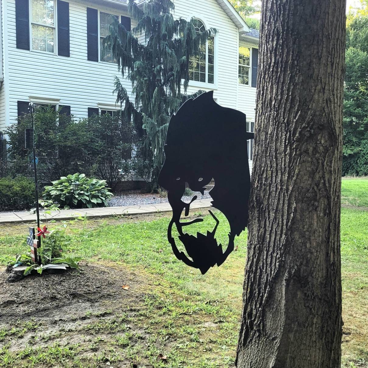 Peeking Bigfoot Metal Garden Stake Metal Garden Stake — lifestyle setting