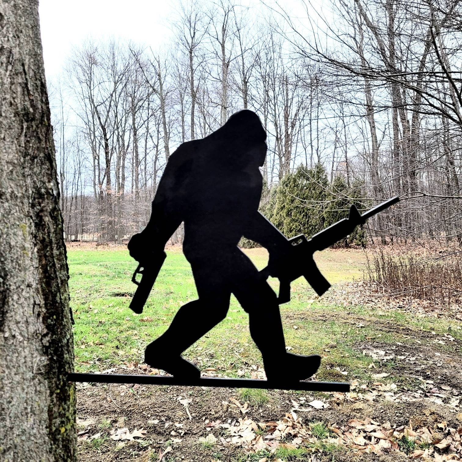 Armed Bigfoot Metal Garden Stake Metal Garden Stake — front view on white background