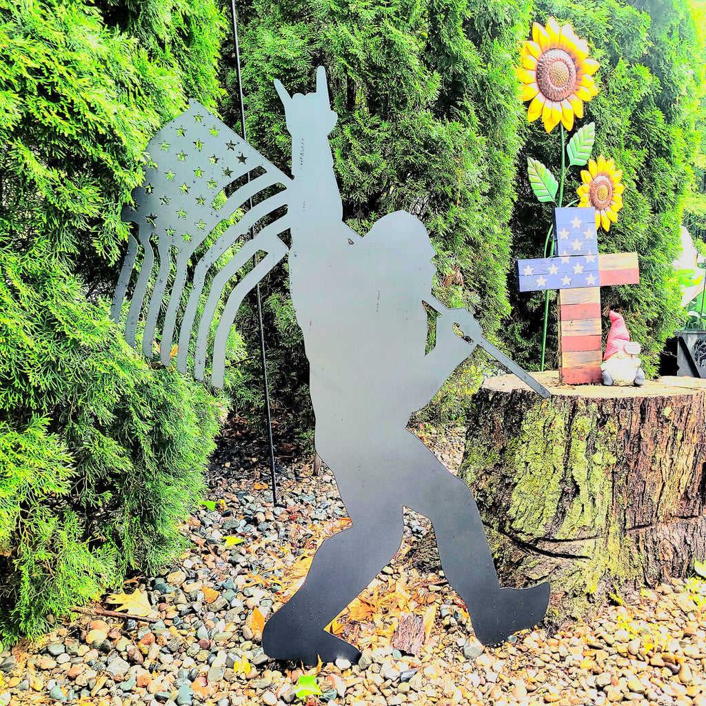 Sasquatch with American Flag Metal Sign Bigfoot Aluminum Sign — shown on a rustic wall