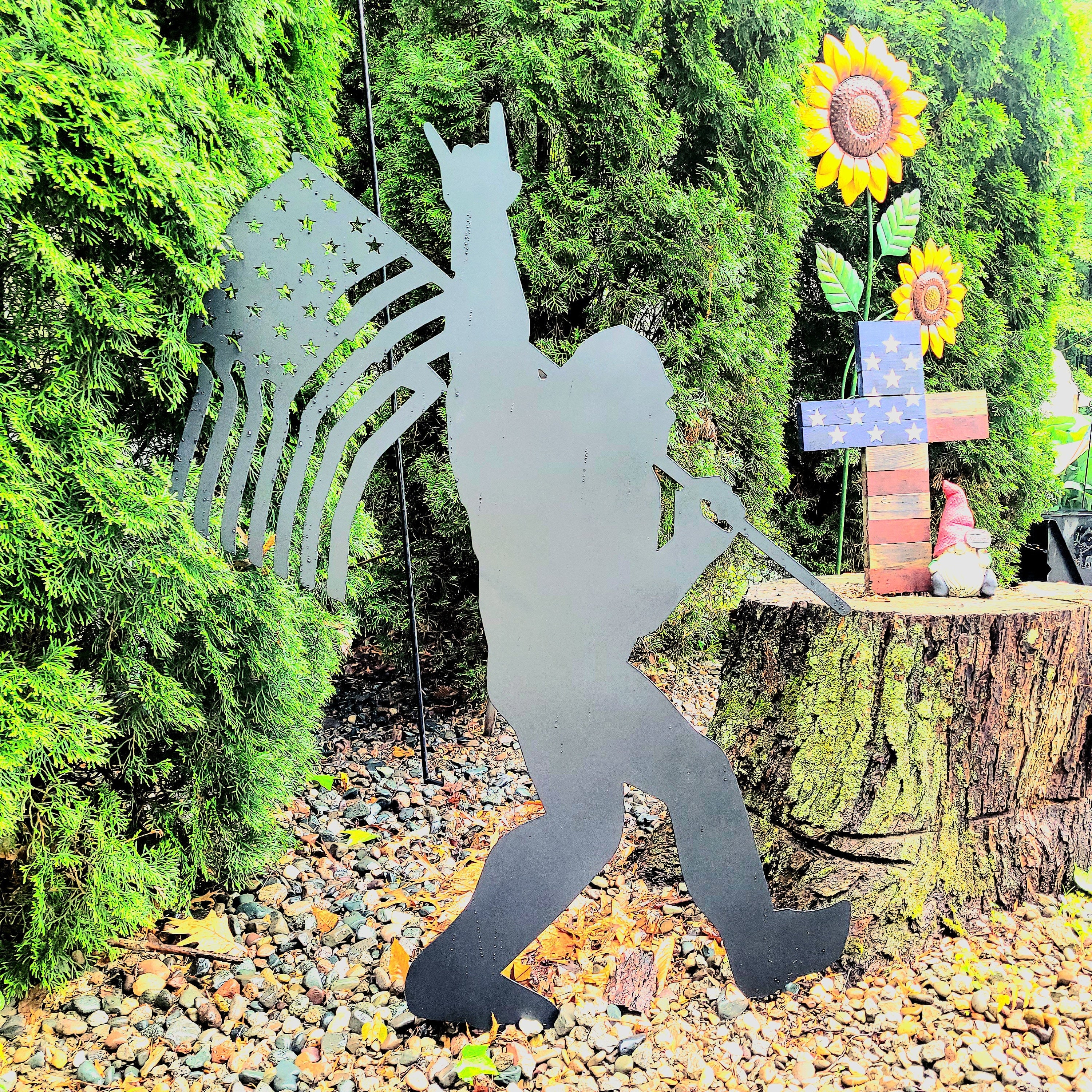 Sasquatch with American Flag Metal Sign Bigfoot Aluminum Sign — shown on a rustic wall