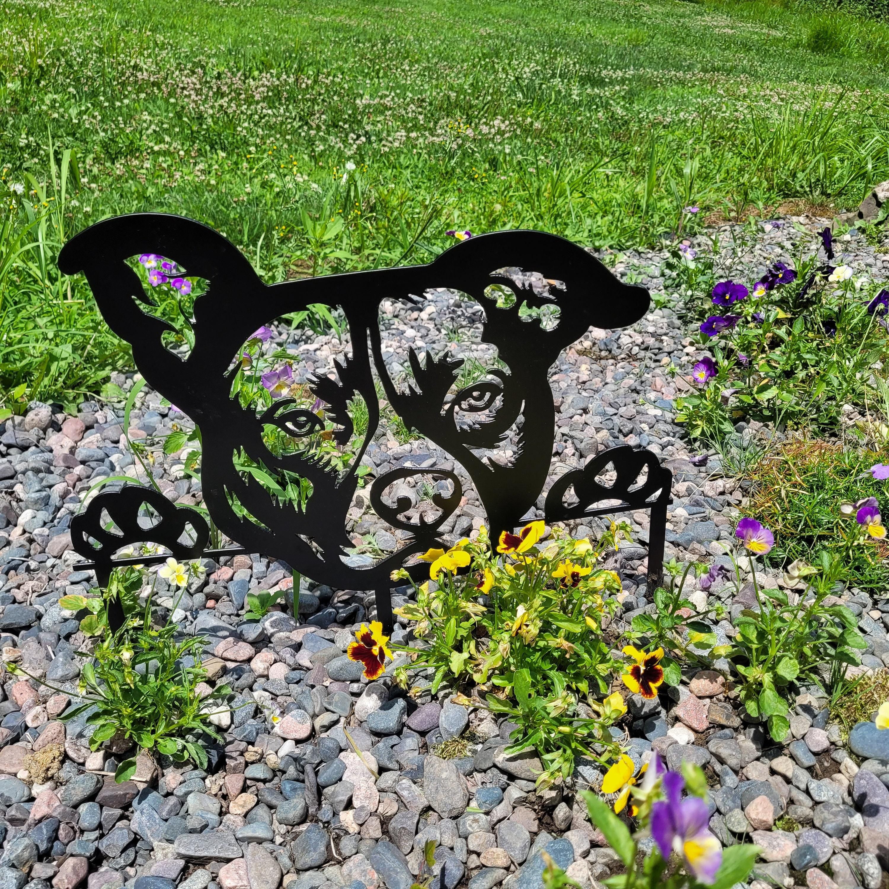 Black Pitbull Garden Stake Metal Garden Stake — shown on a rustic wall