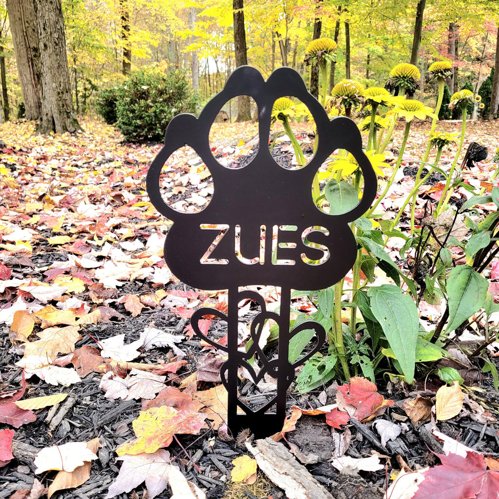 Pet Memorial Ground Stake Metal Garden Stake — shown on a rustic wall