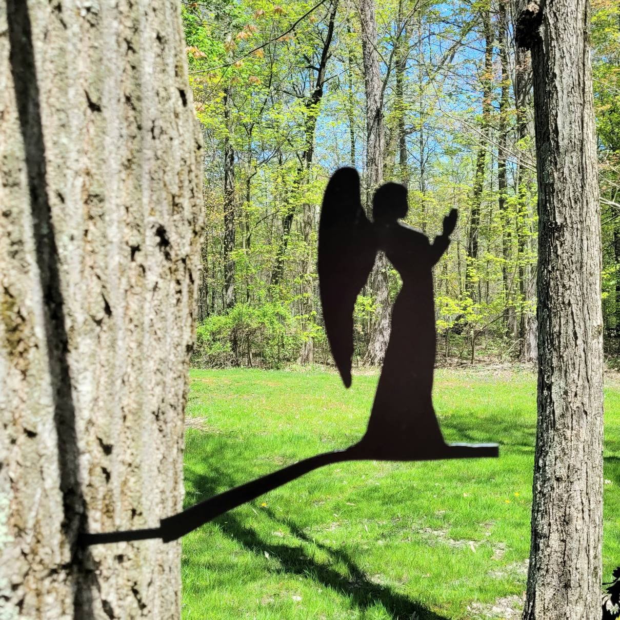 Angel Metal Garden Stake Metal Garden Stake — shown on a rustic wall