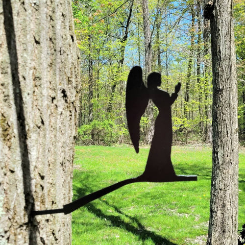 Angel Metal Garden Stake Metal Garden Stake — shown on a rustic wall