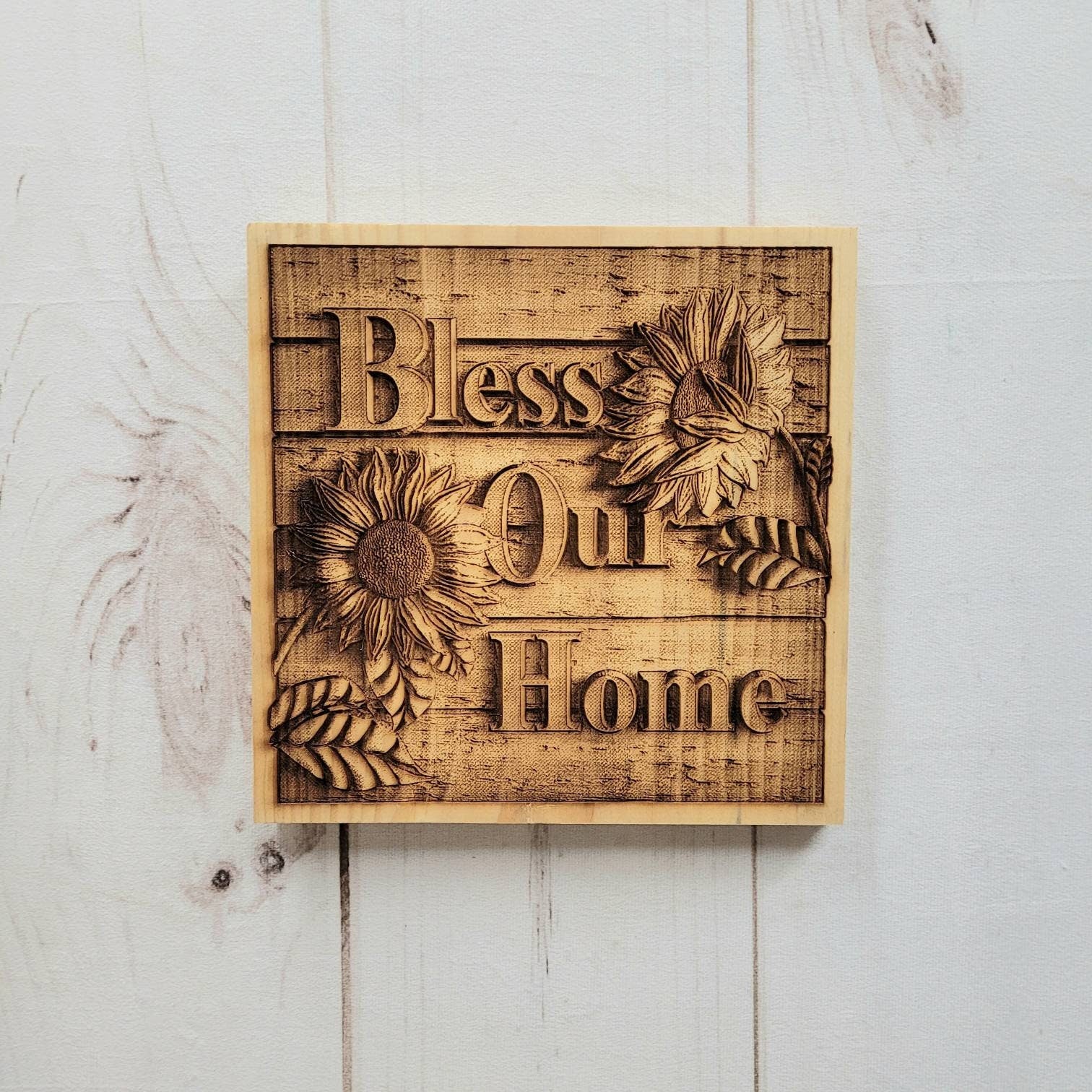 Bless Our Home Sunflower Wood Sign Wood Sign — shown on a rustic wall