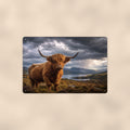 Highland Cow Under Storm Clouds aluminum metal sign 12" x 8" - front view on warm wall