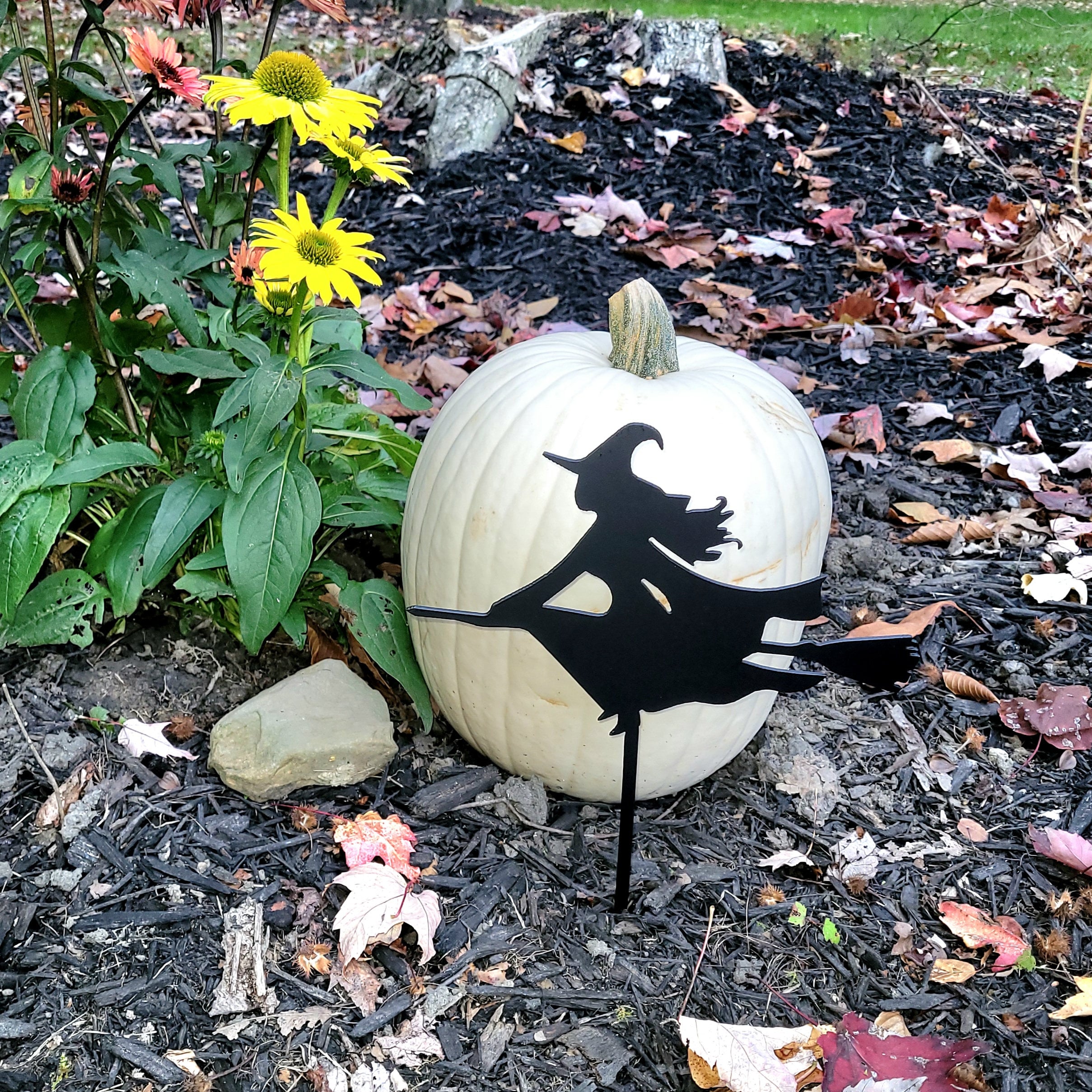 Halloween Witch Metal Garden Stake Metal Garden Stake — shown on a rustic wall