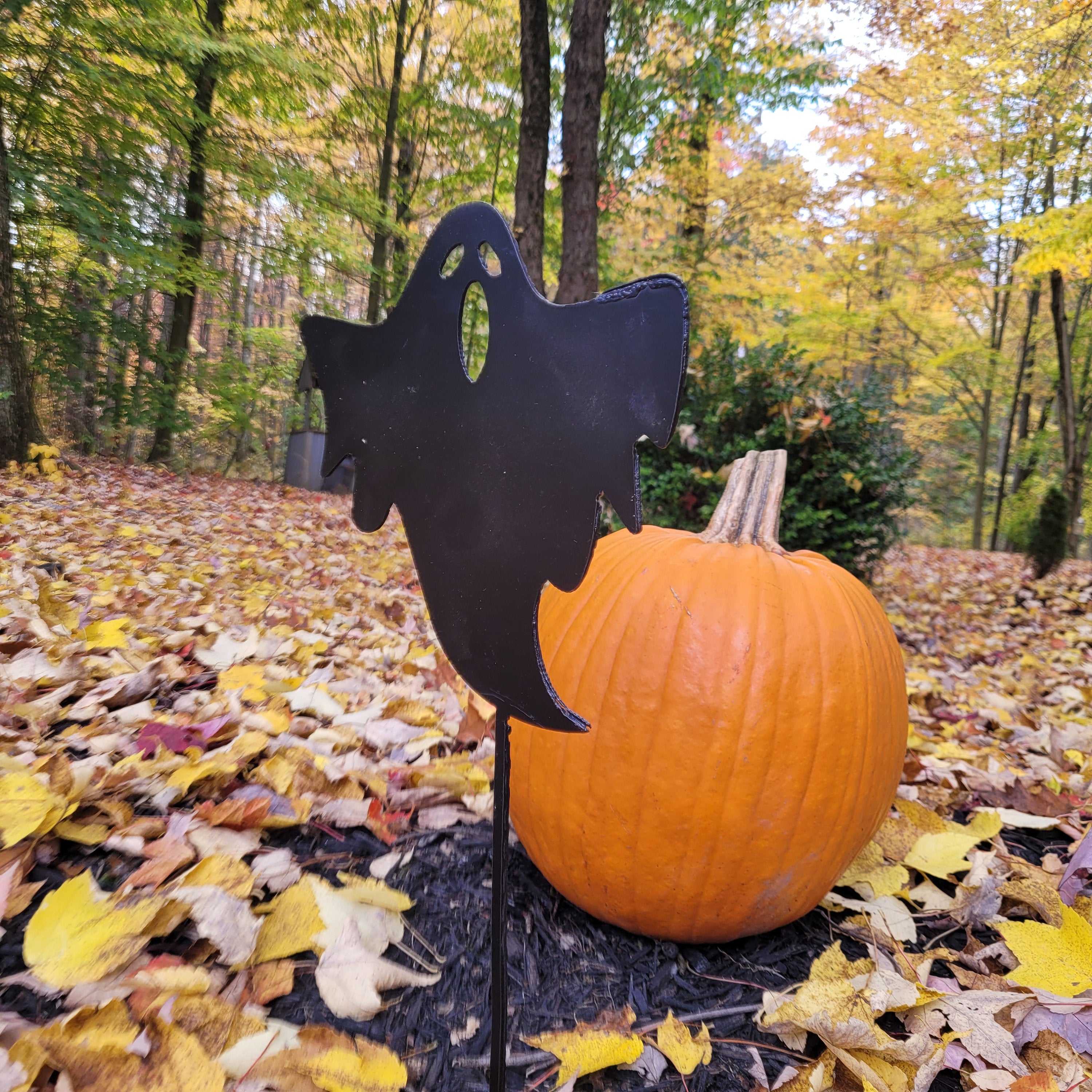 Halloween Ghost Metal Garden Stake Metal Garden Stake — shown on a rustic wall