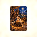 Aluminum sign showing the Holy Family at the manger with a donkey, ox, and lambs, displayed flat against a plain background.