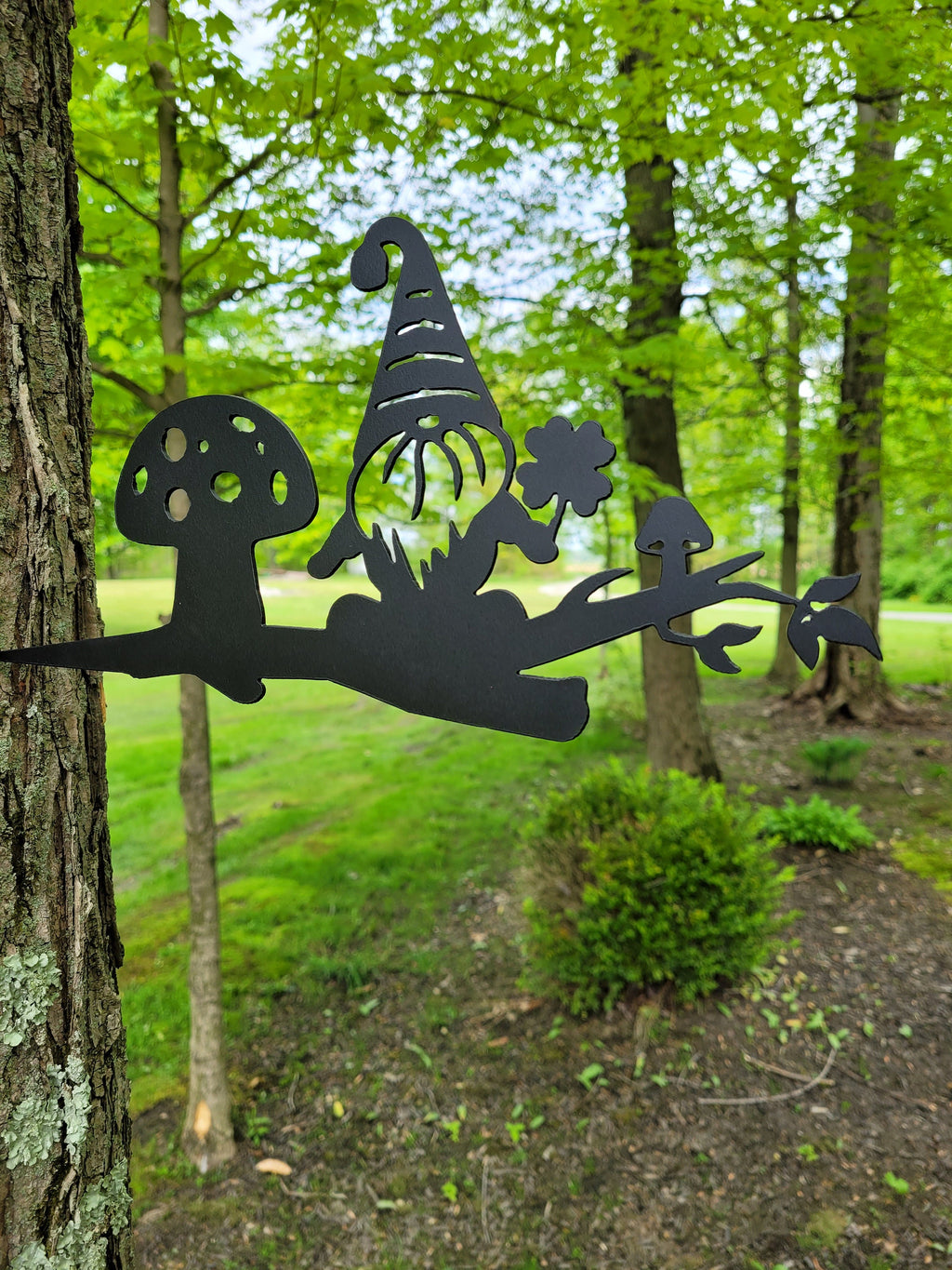 Garden Gnome Metal Garden Stake Metal Garden Stake — shown on a rustic wall
