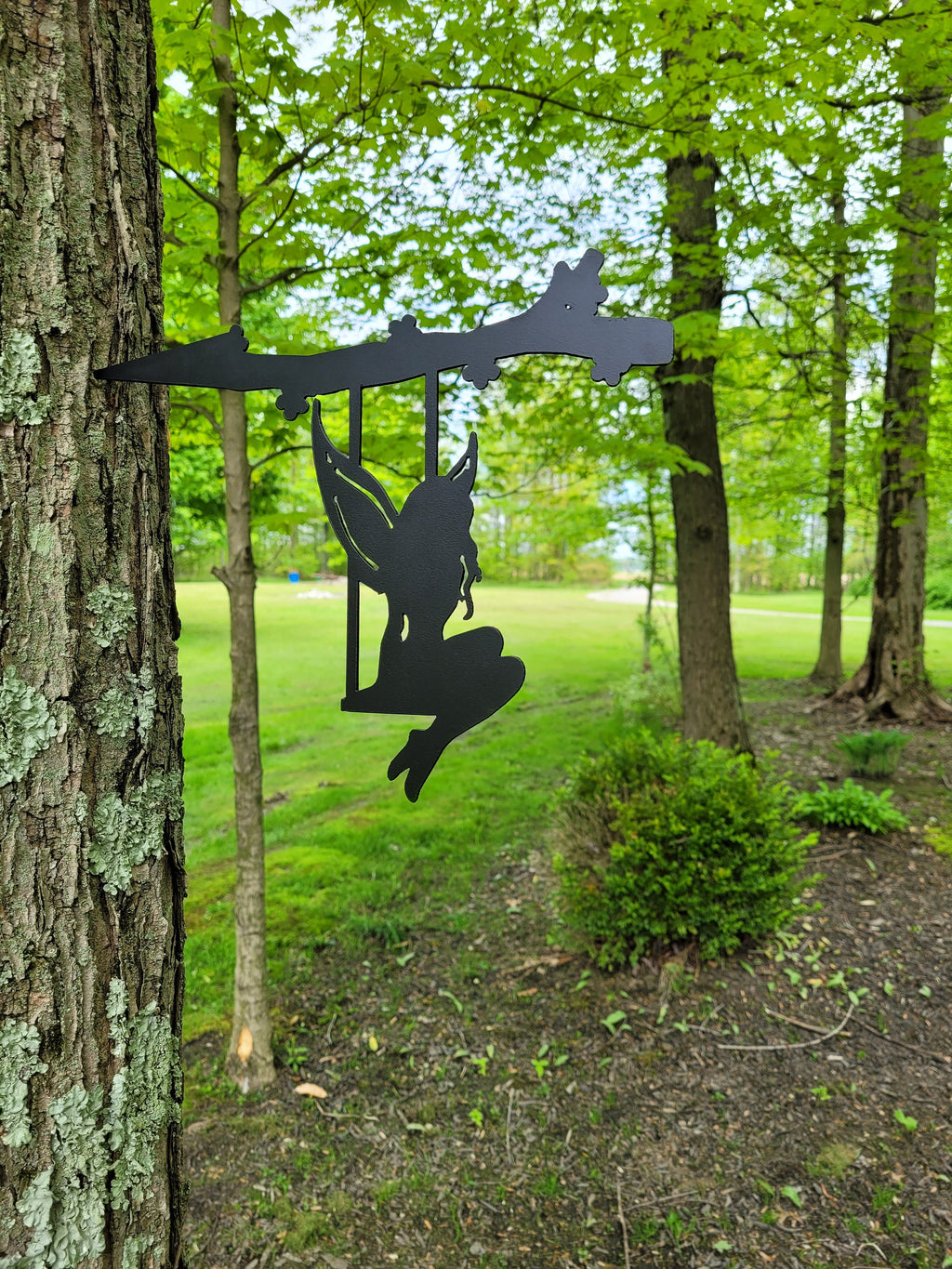 Garden Fairy Metal Garden Stake Metal Garden Stake — shown on a rustic wall