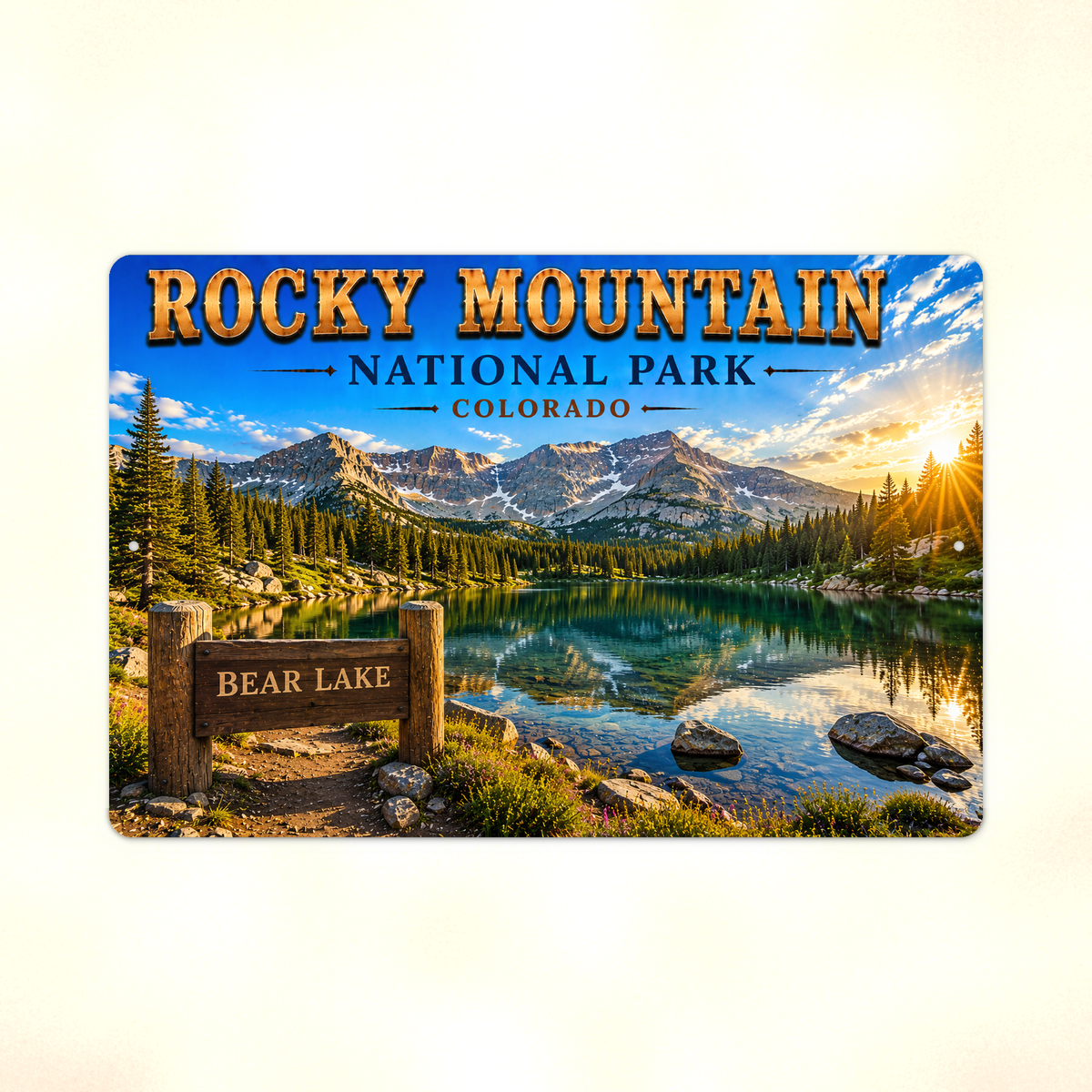 Full view of the sign showing Rocky Mountain Bear Lake lettering and a turquoise lake below snowy mountains against a pale background.