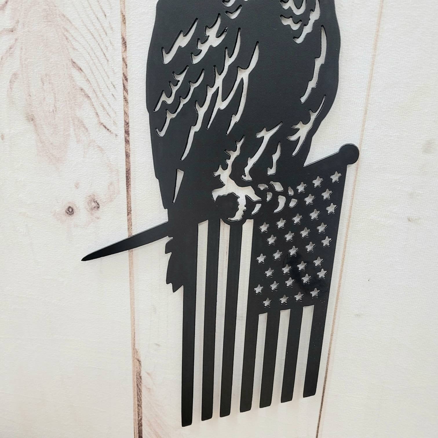 Eagle Flag Metal Garden Stake Metal Garden Stake — shown on a rustic wall