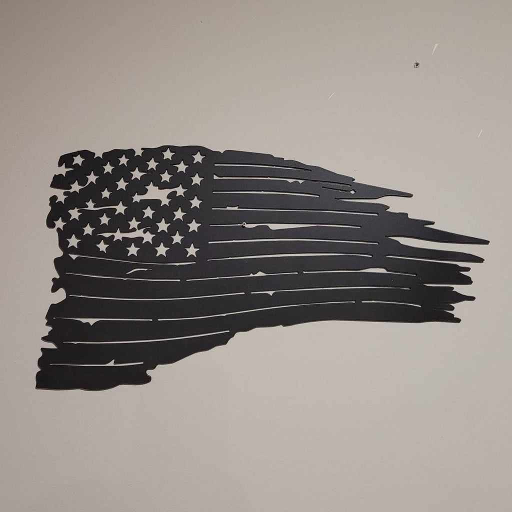 Distressed US Flag Patriotic Metal Sign Aluminum Sign — shown on a rustic wall