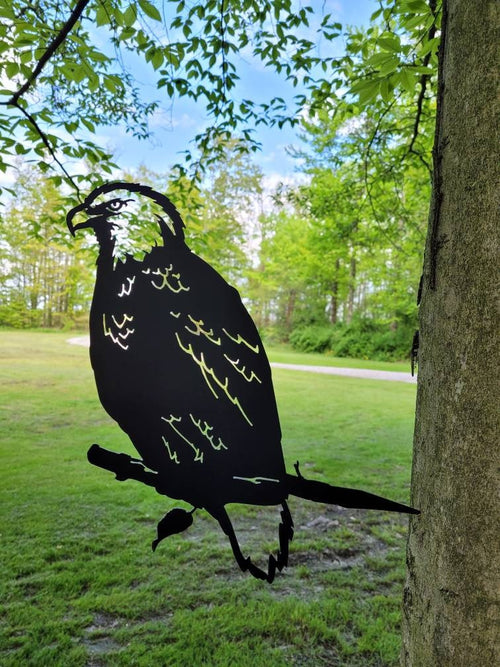 Bald Eagle Metal Garden Stake Metal Garden Stake — shown on a rustic wall