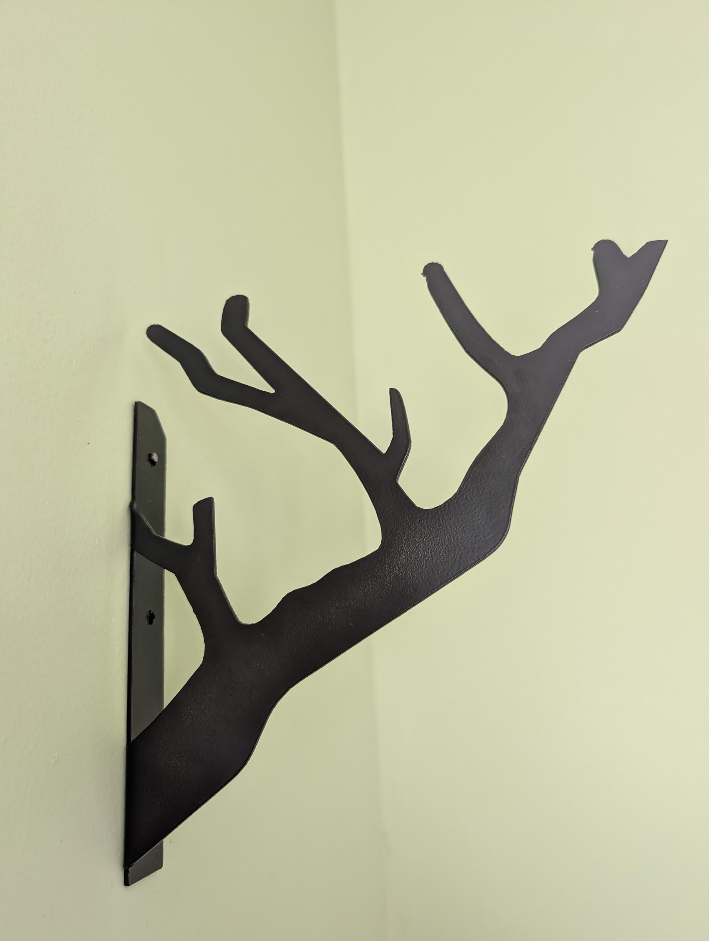 Branch Design Metal Wall Hook Aluminum Sign — shown on a rustic wall