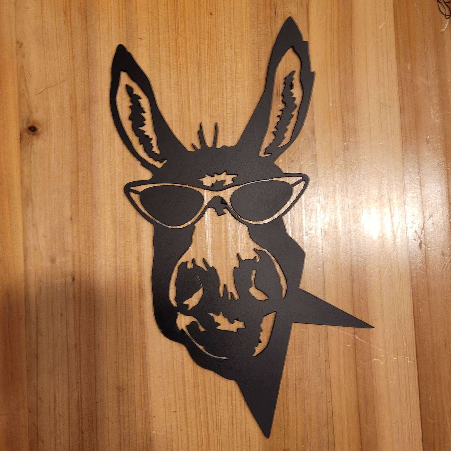 Funny Donkey Metal Garden Stake Metal Garden Stake — shown on a rustic wall