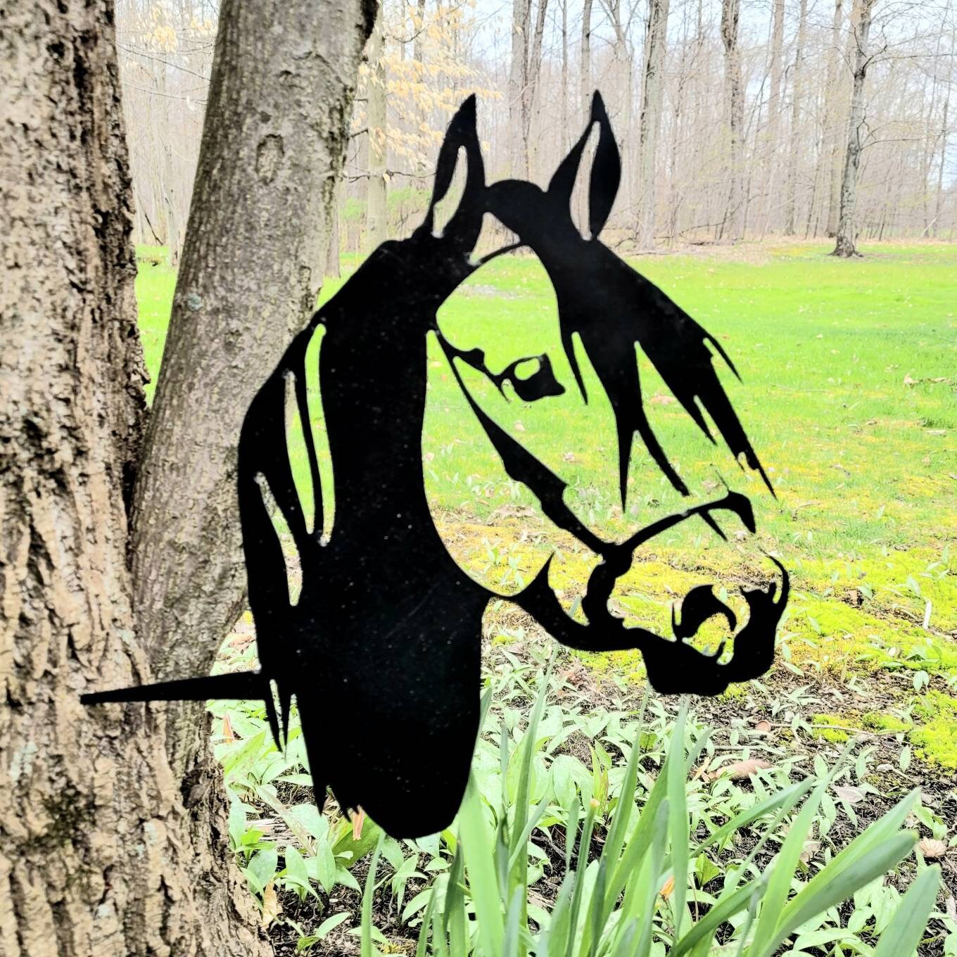 Horse Metal Garden Stake Metal Garden Stake — shown on a rustic wall