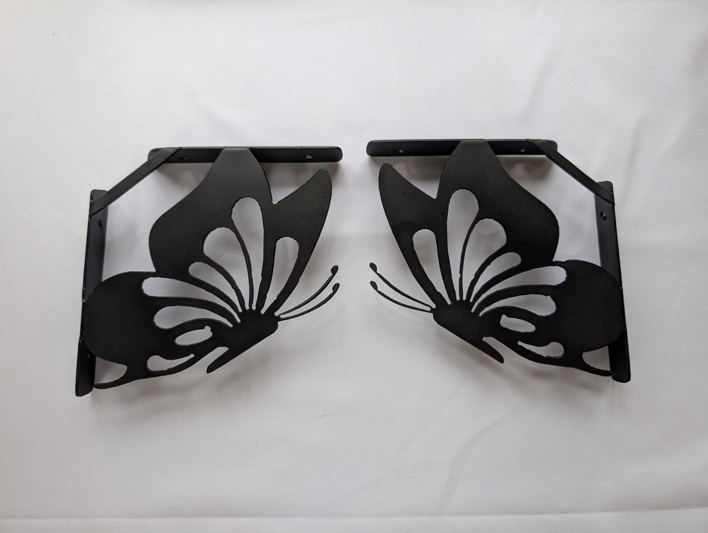 Butterfly Shelf Bracket Set Metal Shelf Bracket — shown on a rustic wall