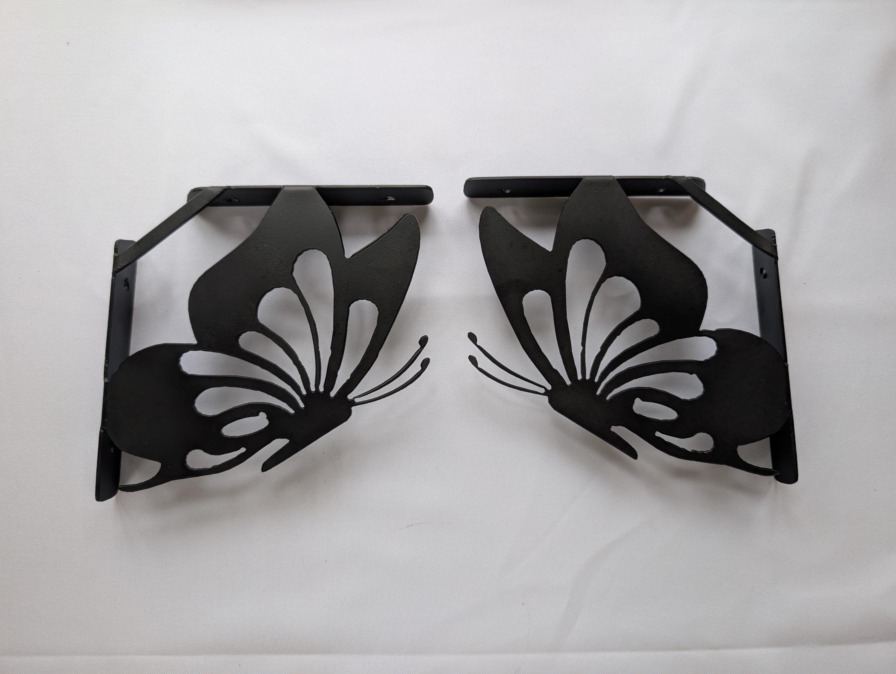 Butterfly Shelf Bracket Set Metal Shelf Bracket — shown on a rustic wall