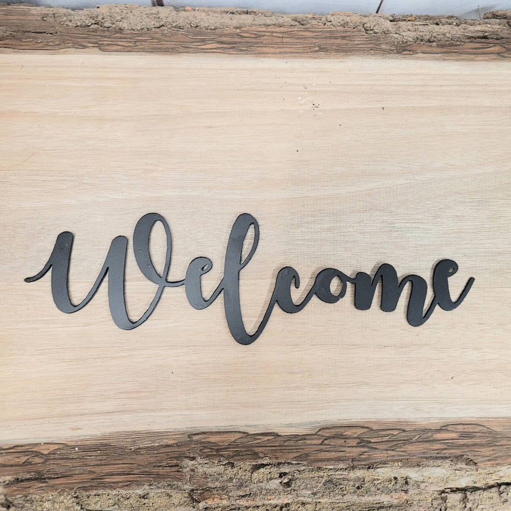 Welcome Metal Wall Sign Aluminum Sign — shown on a rustic wall