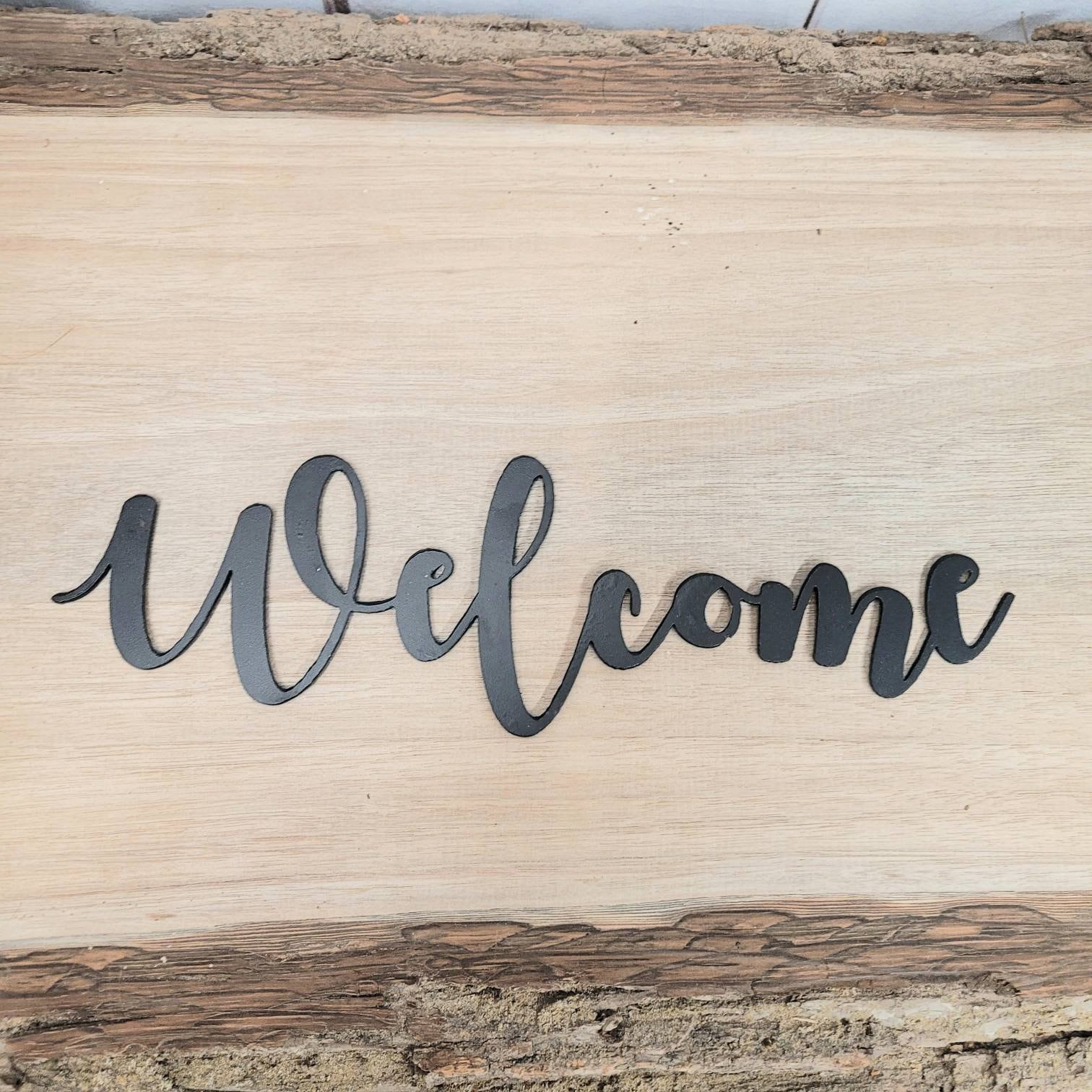 Welcome Metal Wall Sign Aluminum Sign — shown on a rustic wall