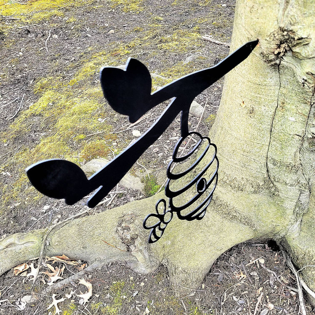 Beehive Metal Garden Stake Metal Garden Stake — shown on a rustic wall