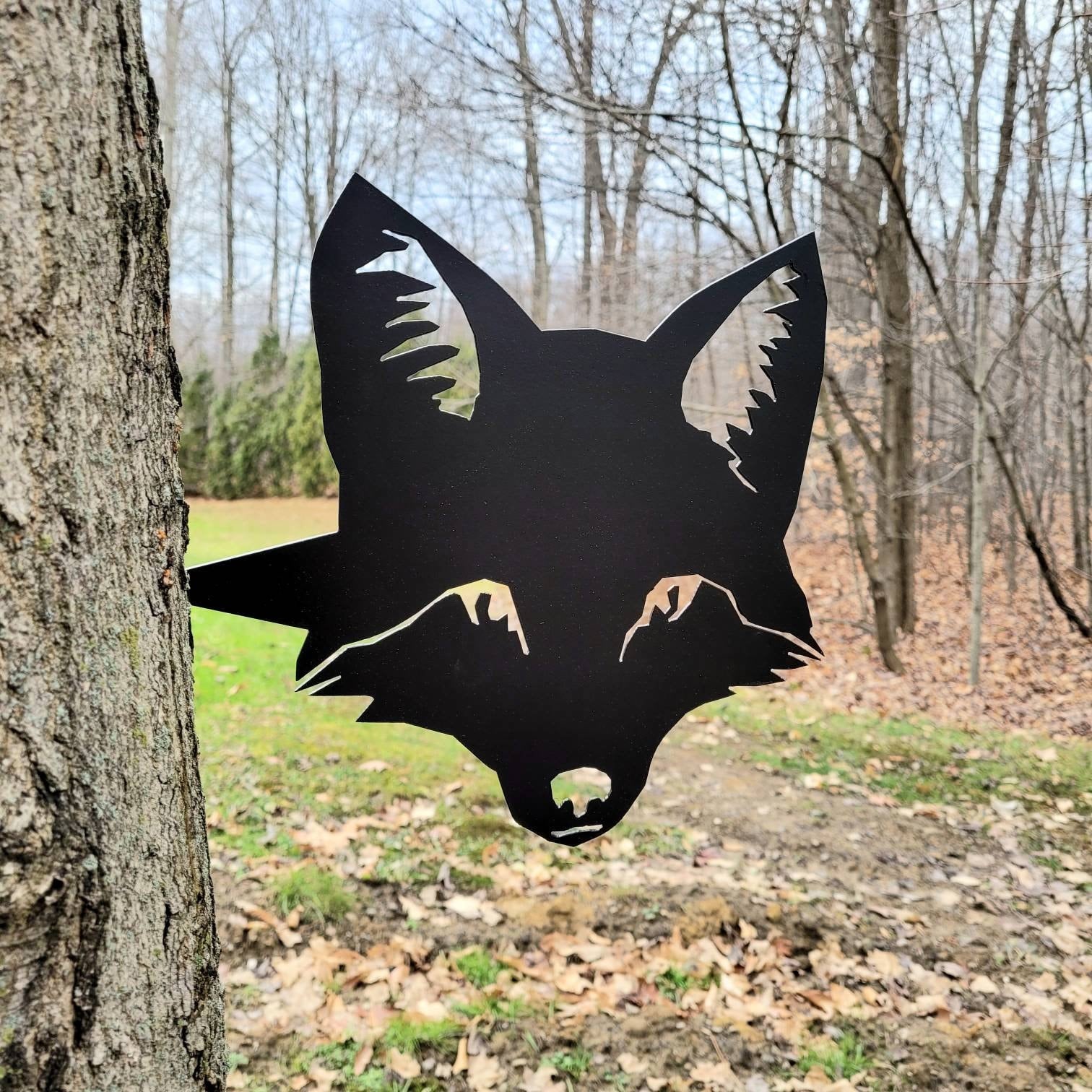 Fox Metal Garden Stake Metal Garden Stake — shown on a rustic wall