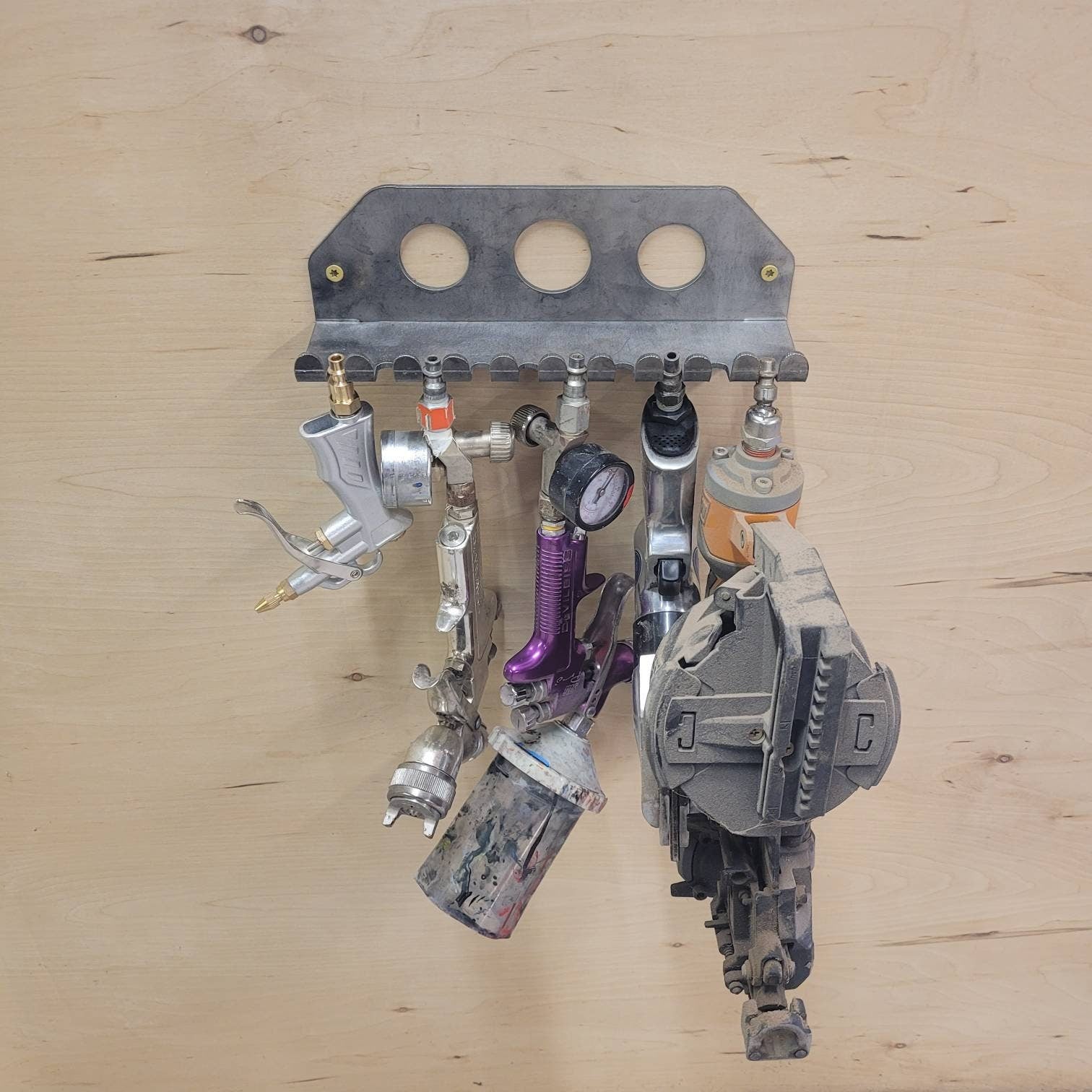 Air Tool Organizer Aluminum Sign — shown on a rustic wall