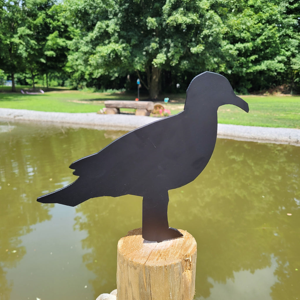 Seagull Metal Garden Stake Metal Garden Stake — shown on a rustic wall