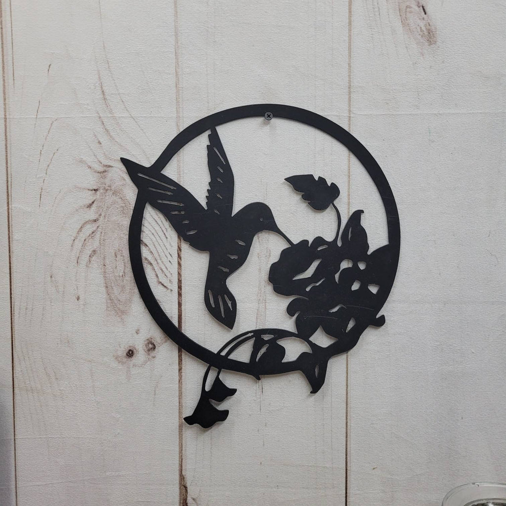Hummingbird Metal Wall Art Metal Garden Stake — shown on a rustic wall