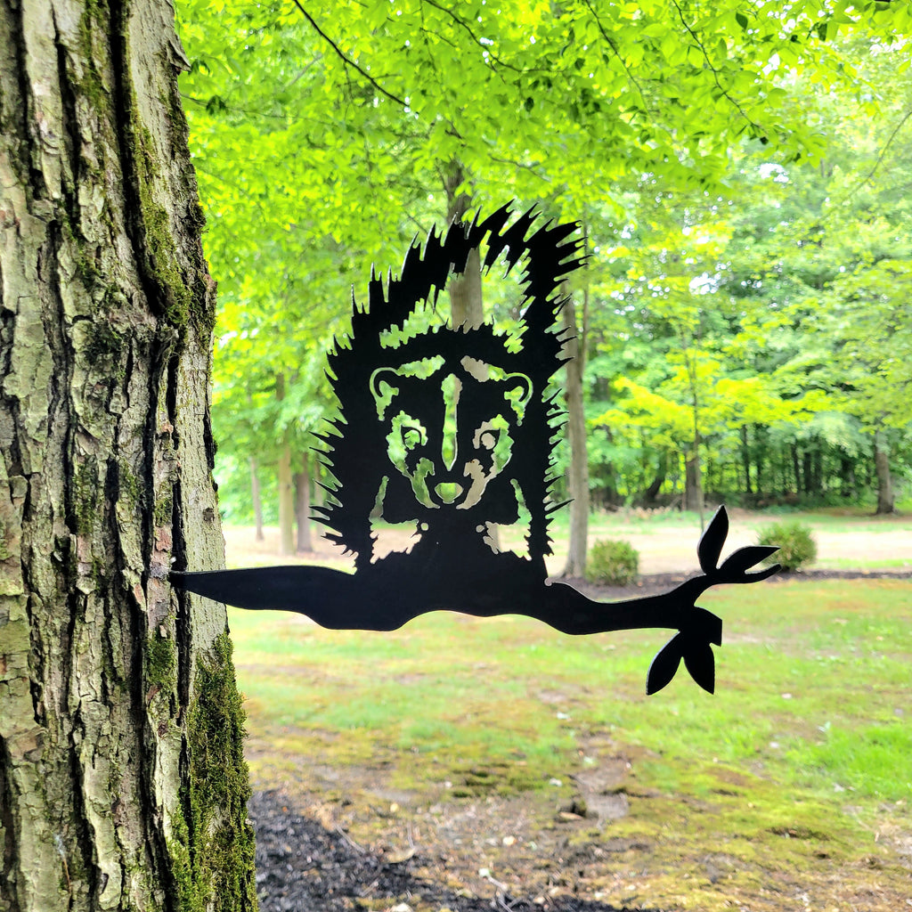 Skunk Metal Garden Stake Metal Garden Stake — shown on a rustic wall