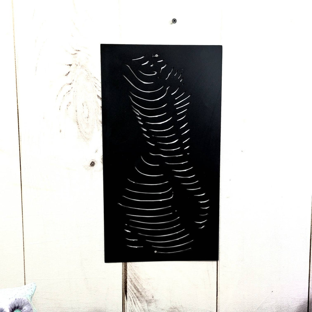 Abstract Female Torso Metal Wall Art Aluminum Sign — shown on a rustic wall