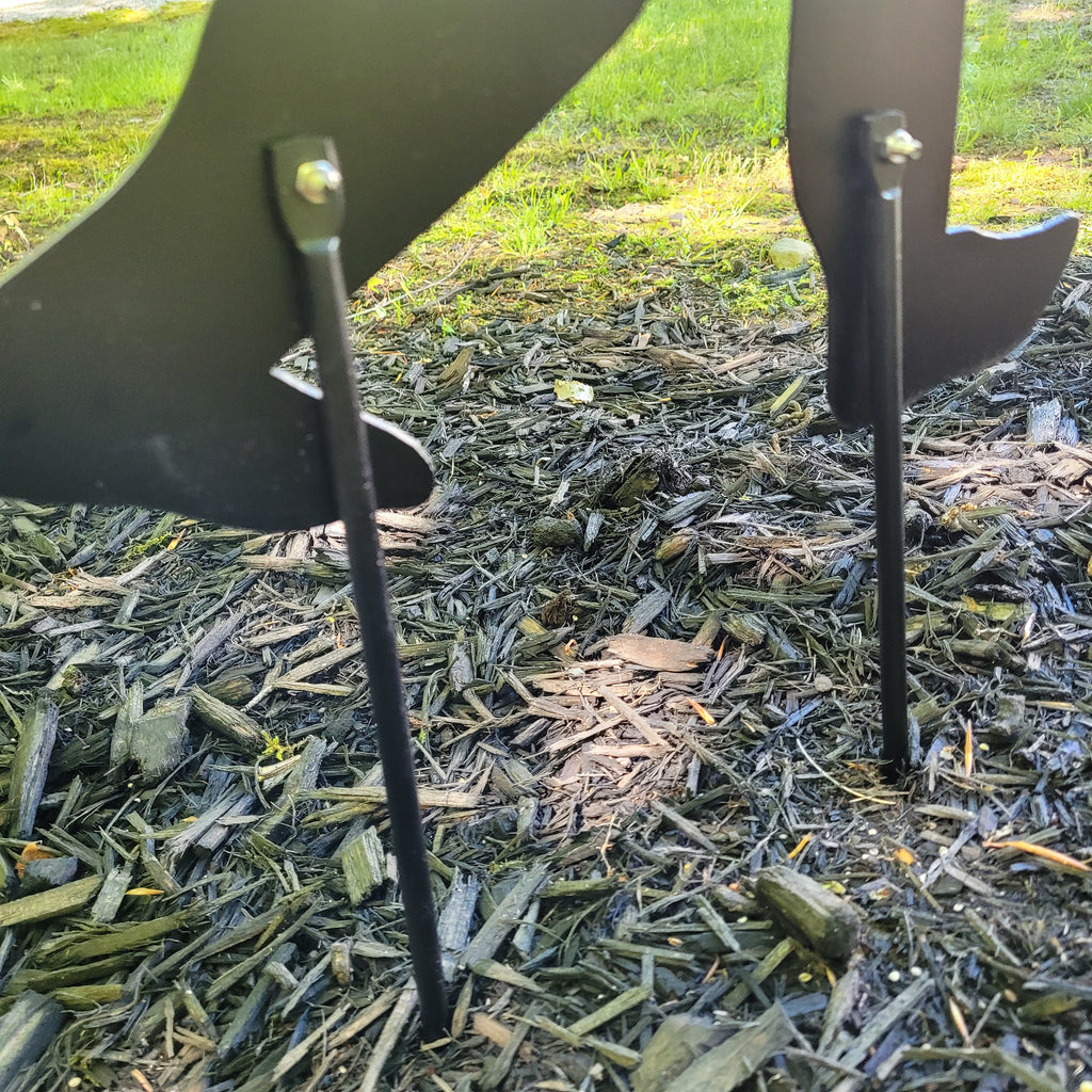 Ground Stake Add-On Metal Garden Stake — shown on a rustic wall
