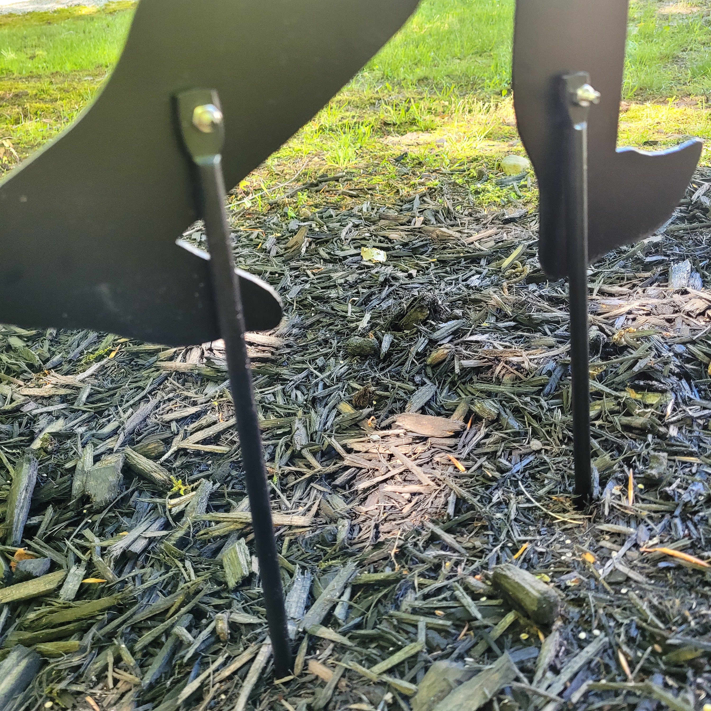 Ground Stake Add-On Metal Garden Stake — shown on a rustic wall