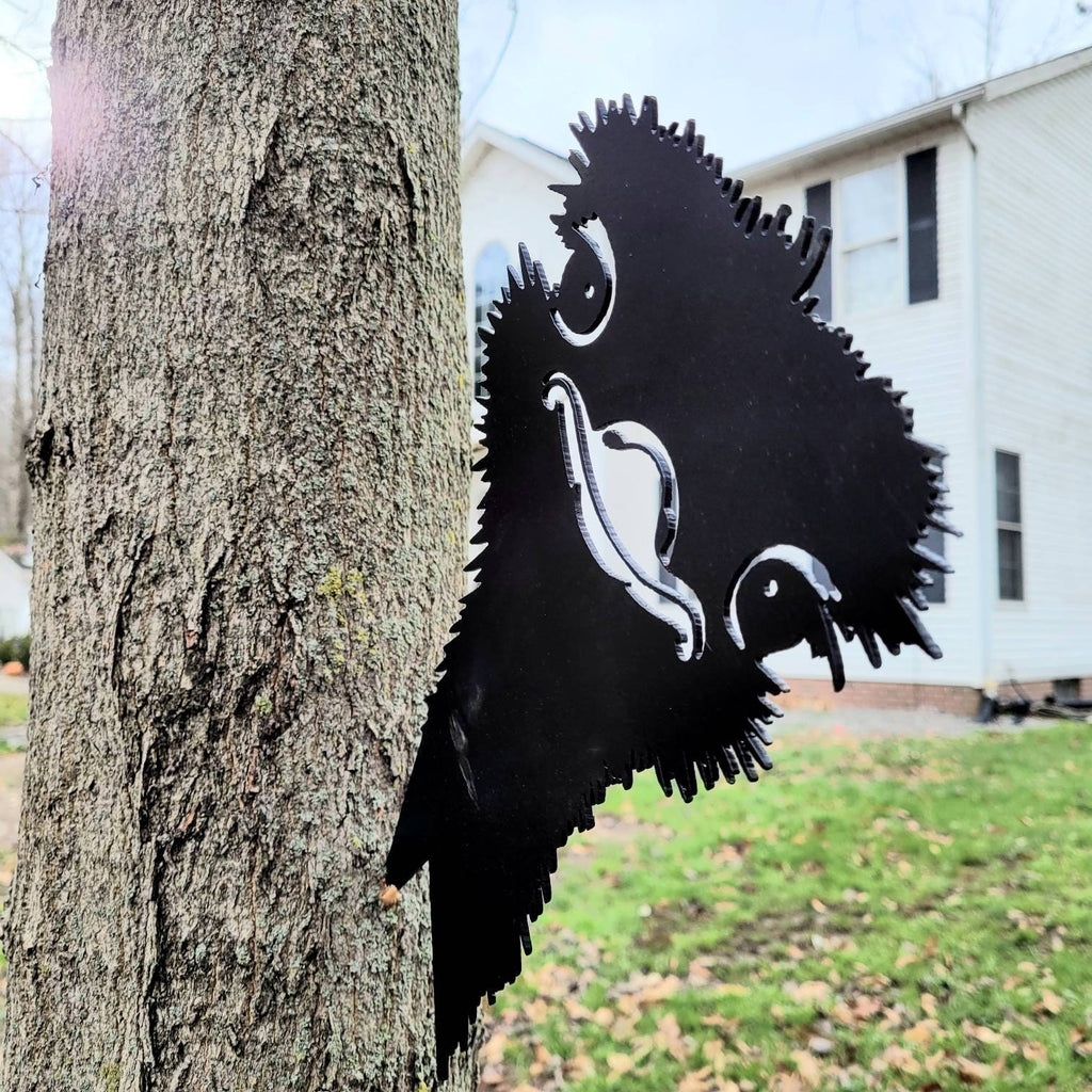 Funny Ostrich Metal Garden Stake Metal Garden Stake — shown on a rustic wall