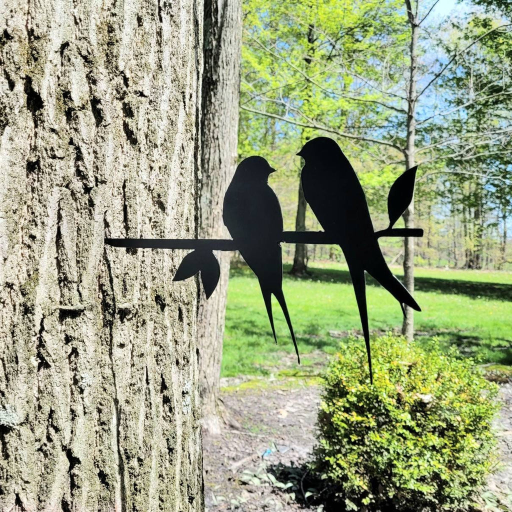 Love Birds Metal Garden Stake Metal Garden Stake — shown on a rustic wall