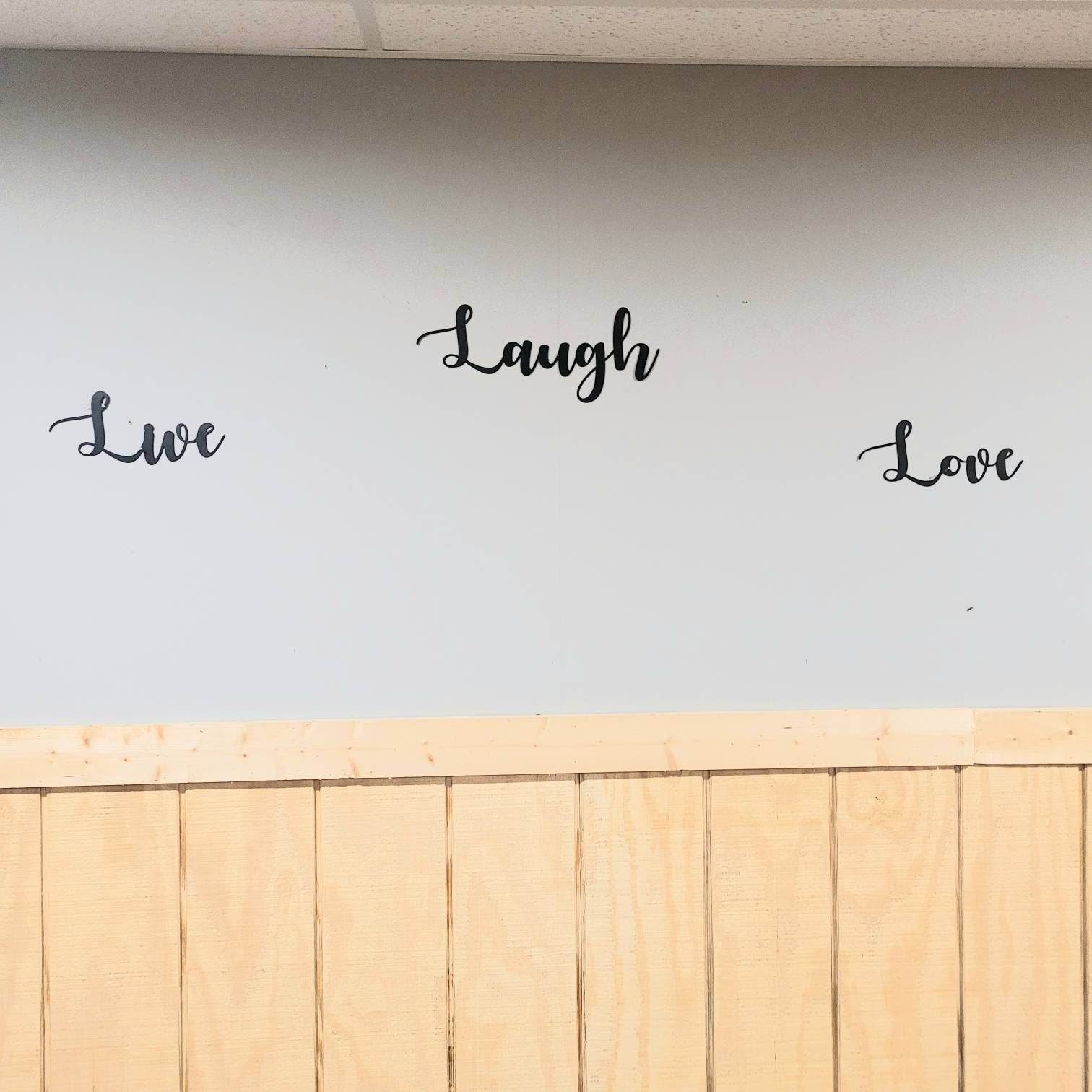 Live Laugh Love Metal Sign Aluminum Sign — shown on a rustic wall