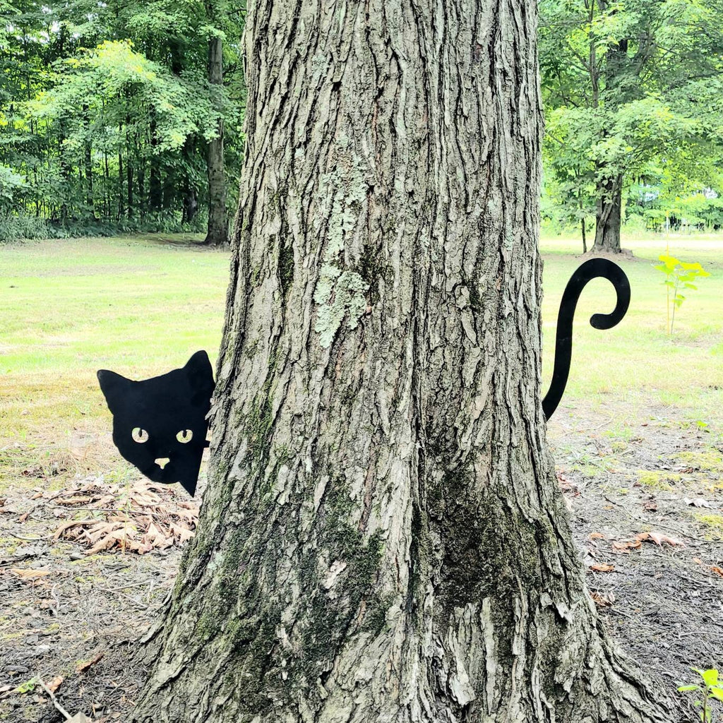 Black Cat Metal Garden Stake Metal Garden Stake — shown on a rustic wall