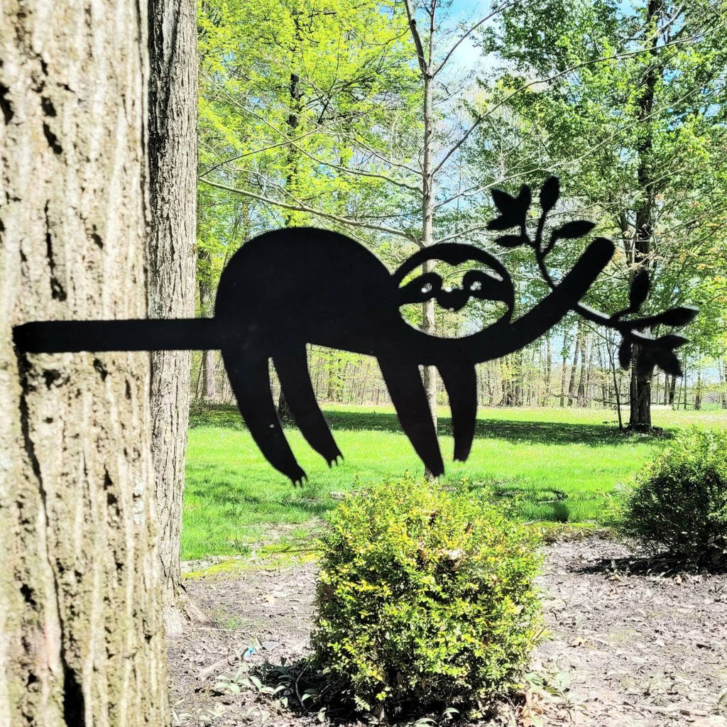 Sloth Metal Garden Stake Metal Garden Stake — shown on a rustic wall