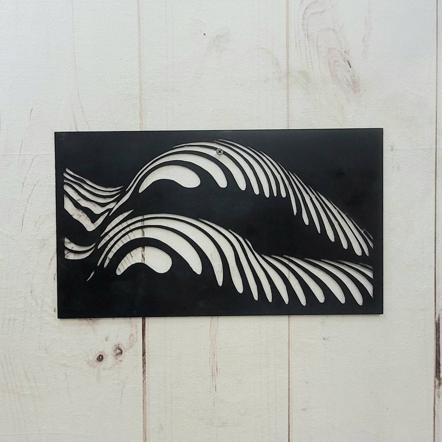 Abstract Female Body Metal Wall Art Aluminum Sign — shown on a rustic wall