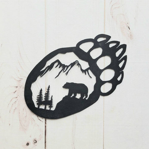 Bear Paw Metal Wall Art Aluminum Sign — shown on a rustic wall