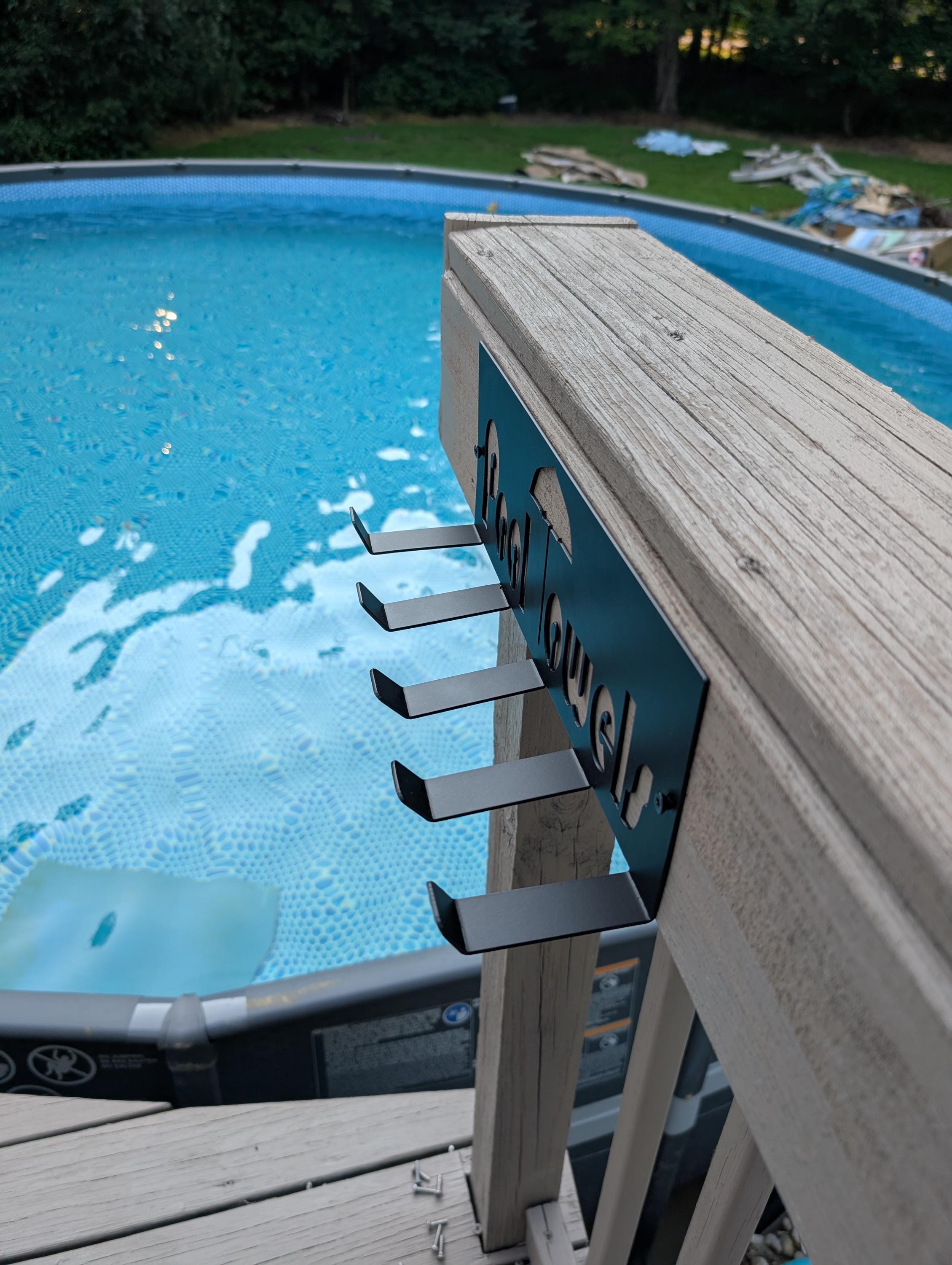 Pool Towel Hanger Aluminum Sign — lifestyle setting