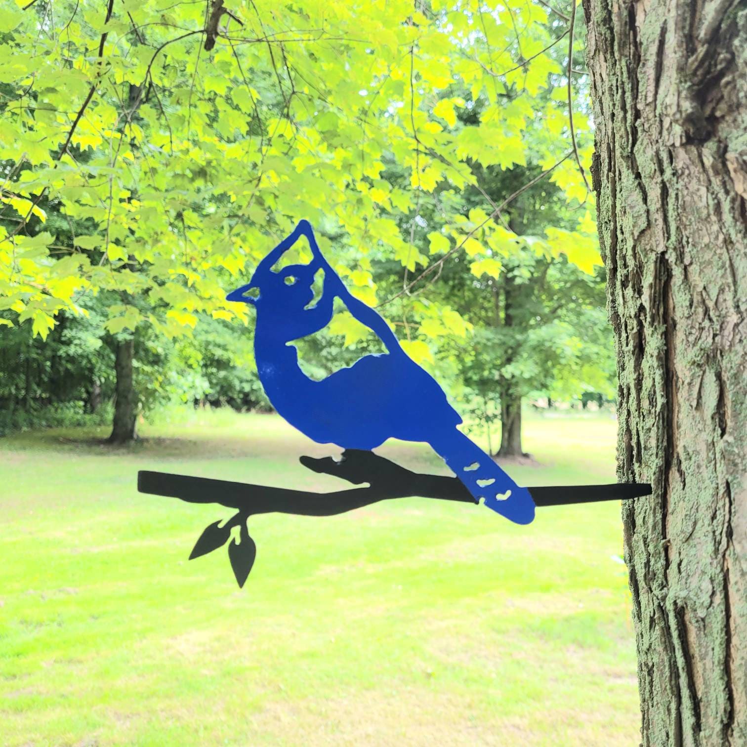 Blue Jay Metal Garden Stake Metal Garden Stake — shown on a rustic wall