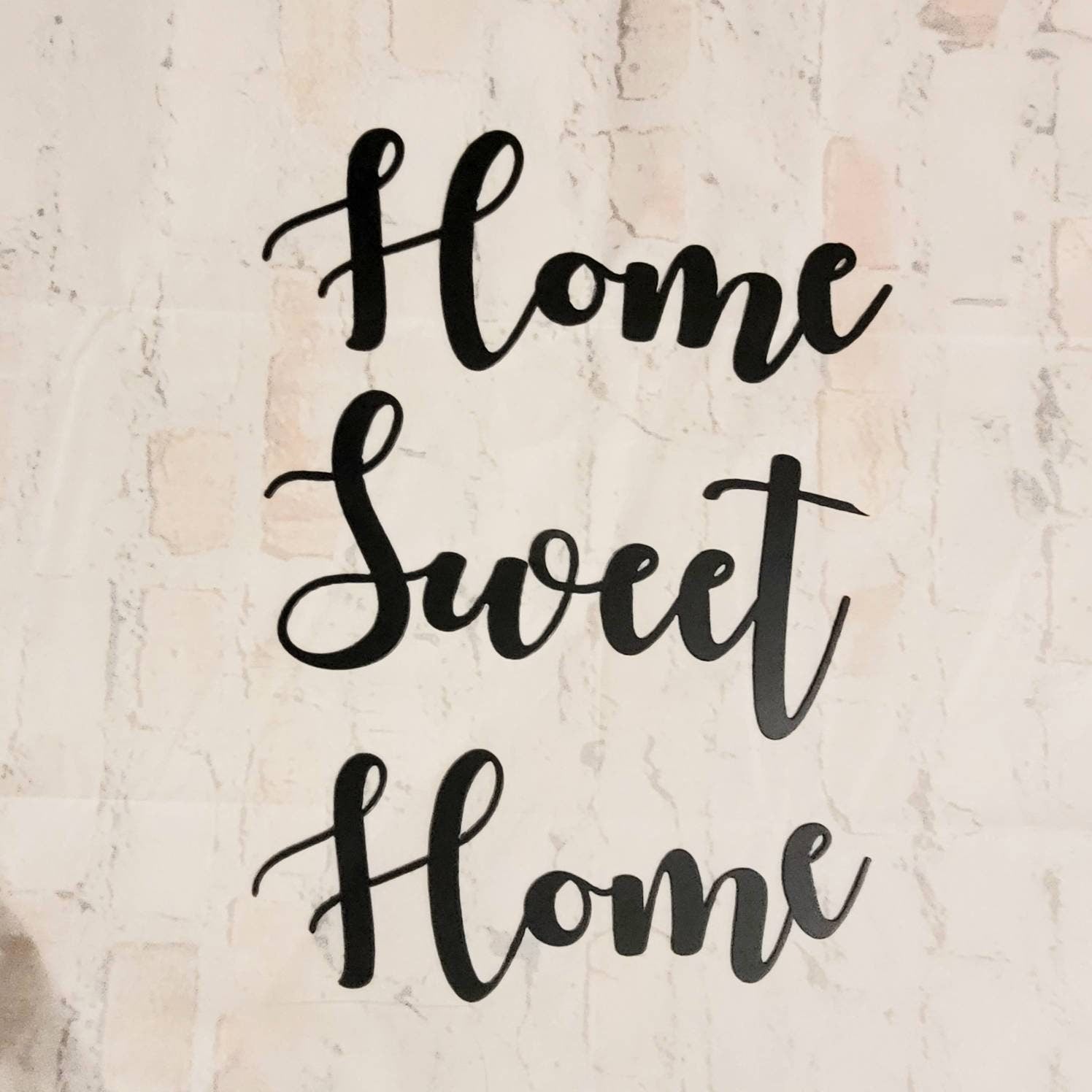 Home Sweet Home Metal Sign Aluminum Sign — shown on a rustic wall
