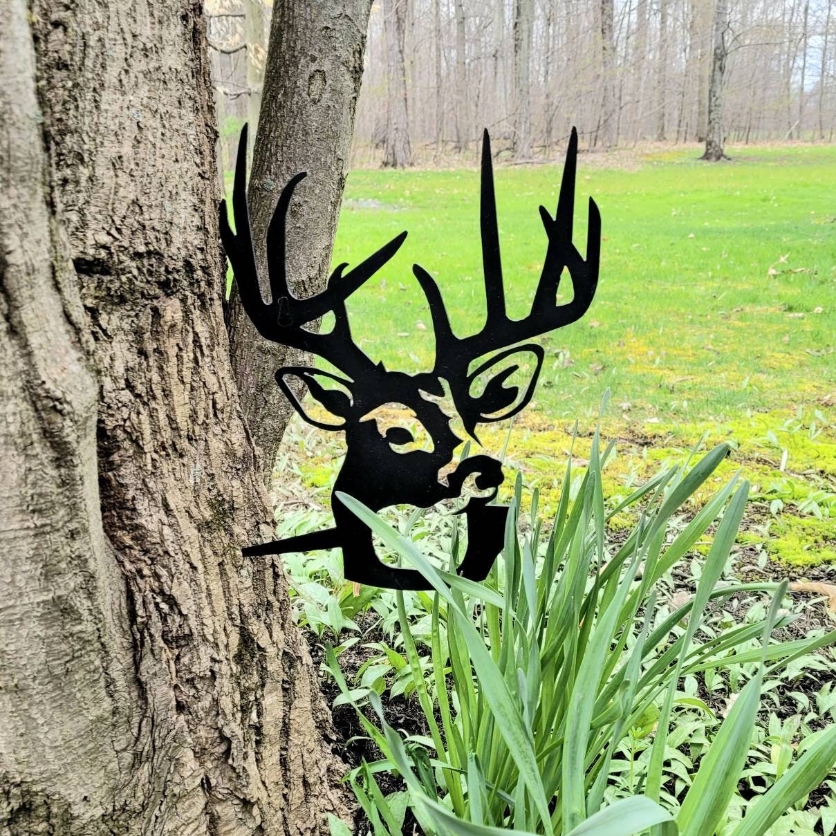 Buck Deer Metal Garden Stake Metal Garden Stake — shown on a rustic wall