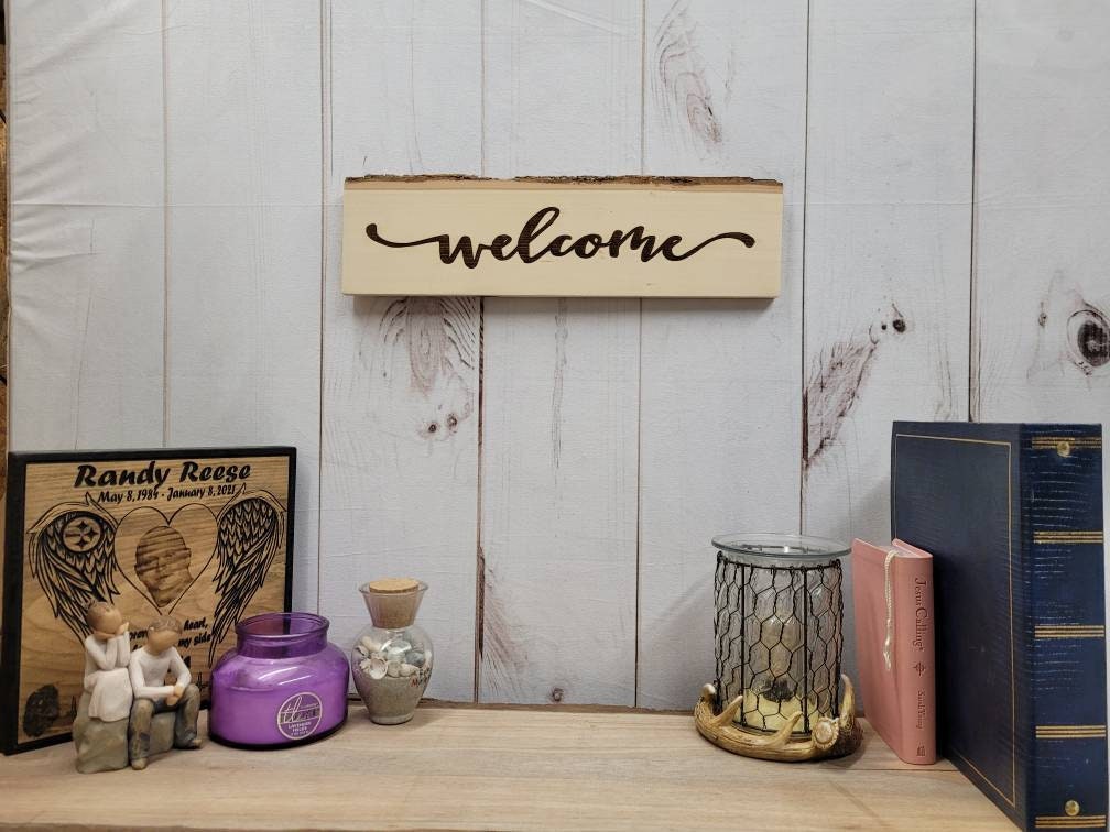 Rustic Live Edge Welcome Sign Wood Sign — shown on a rustic wall