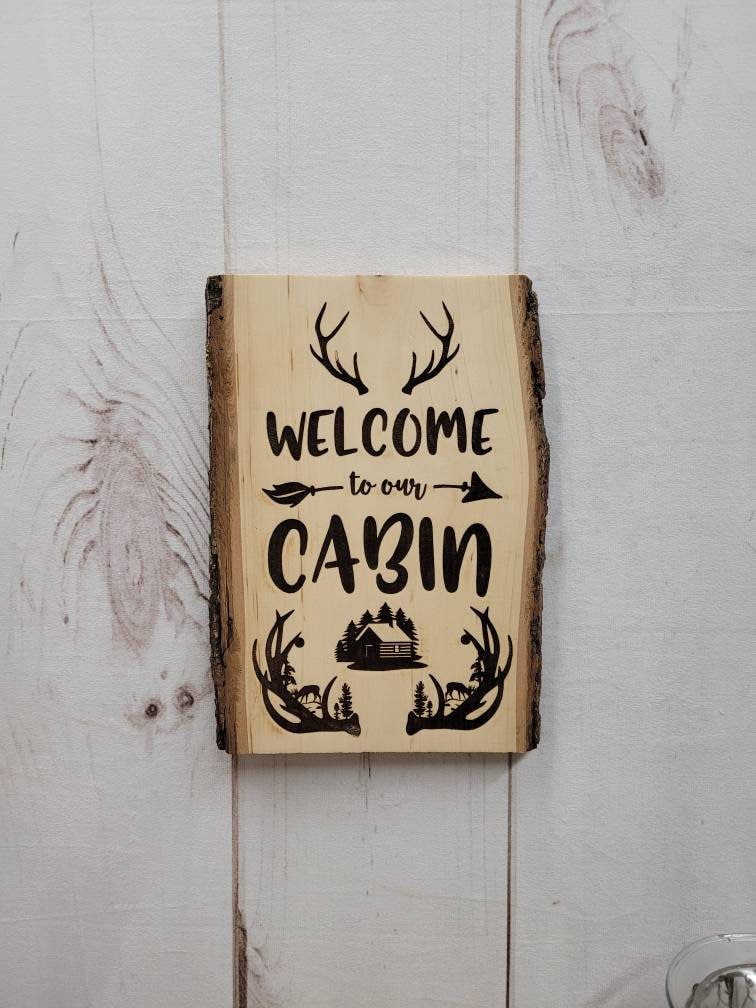 Live Edge Wood Welcome Sign Wood Sign — shown on a rustic wall