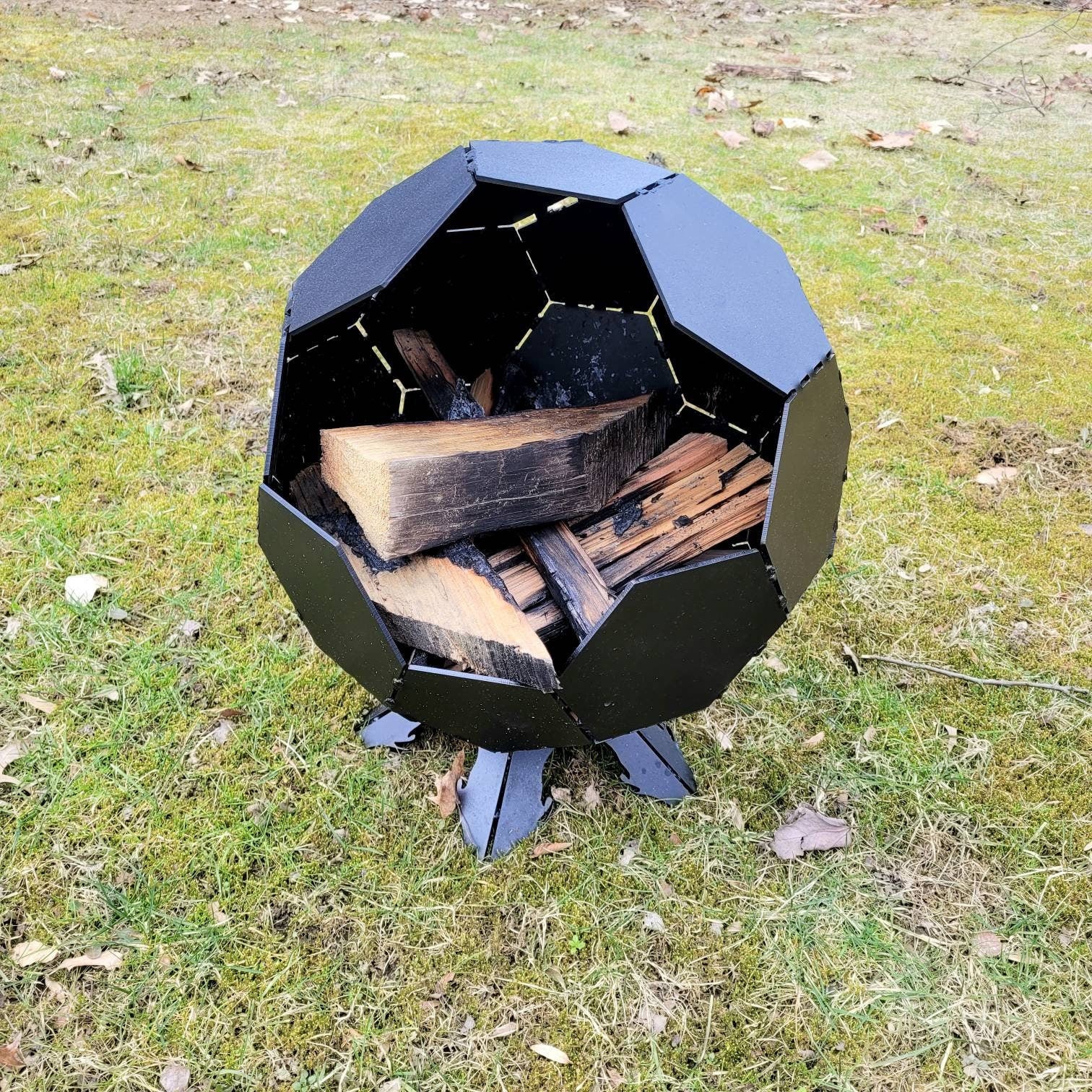 Customizable Globe Fire Pit Aluminum Sign — shown on a rustic wall